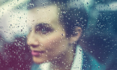 woman looking through glass